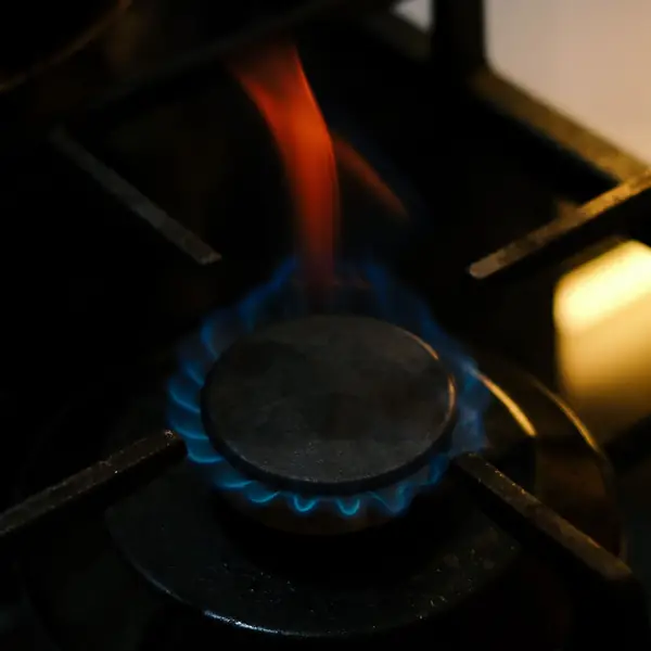 Lit gas stove burner
