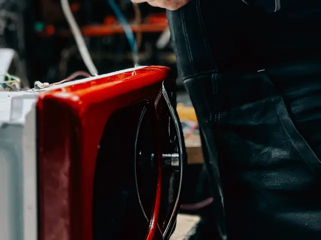 Microwave being repaired on a workbench